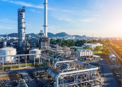 Aerial view of chemical oil refinery plant, power plant on blue Aerial view of chemical oil refinery plant, power plant on blue